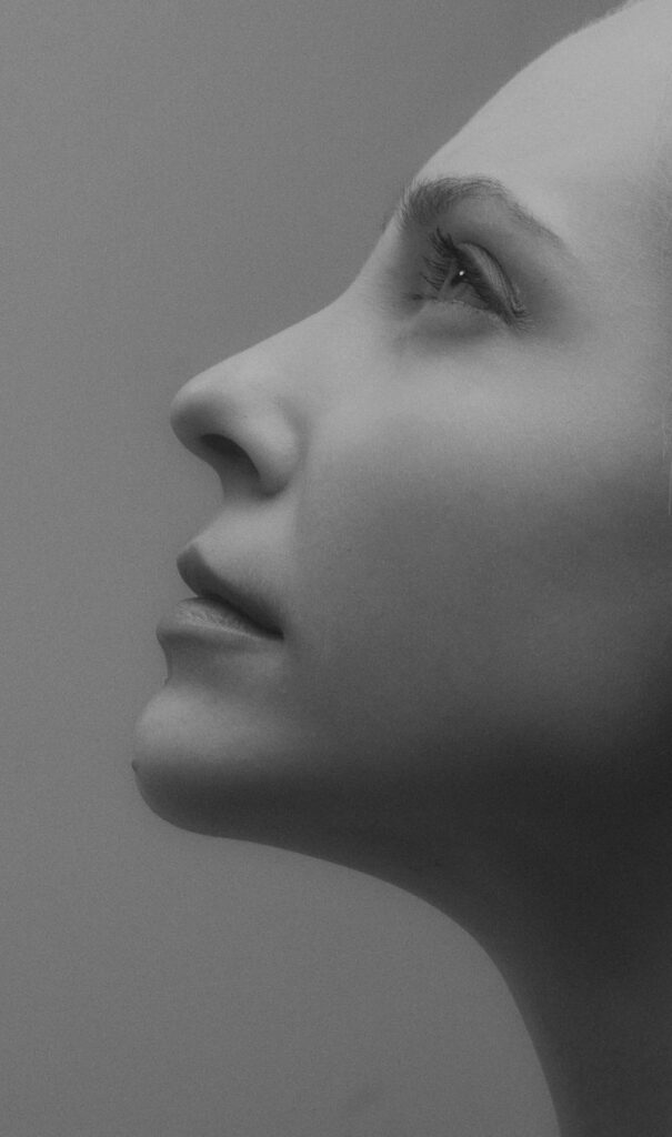 Chin surgery patient before — side profile showing chin position